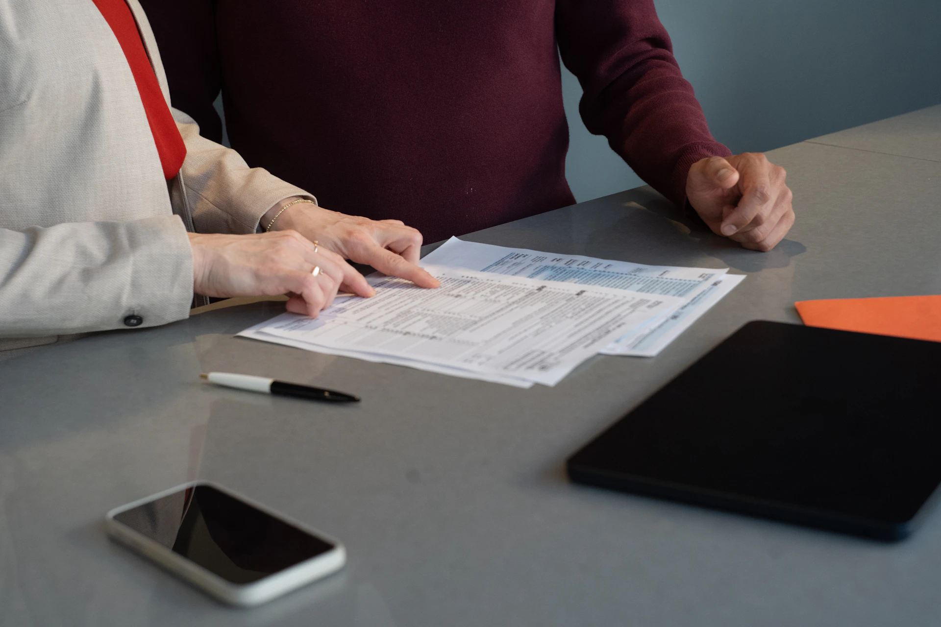 Professionals reviewing financial paperwork together