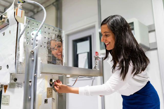 Space operations engineer maintaining precision equipment