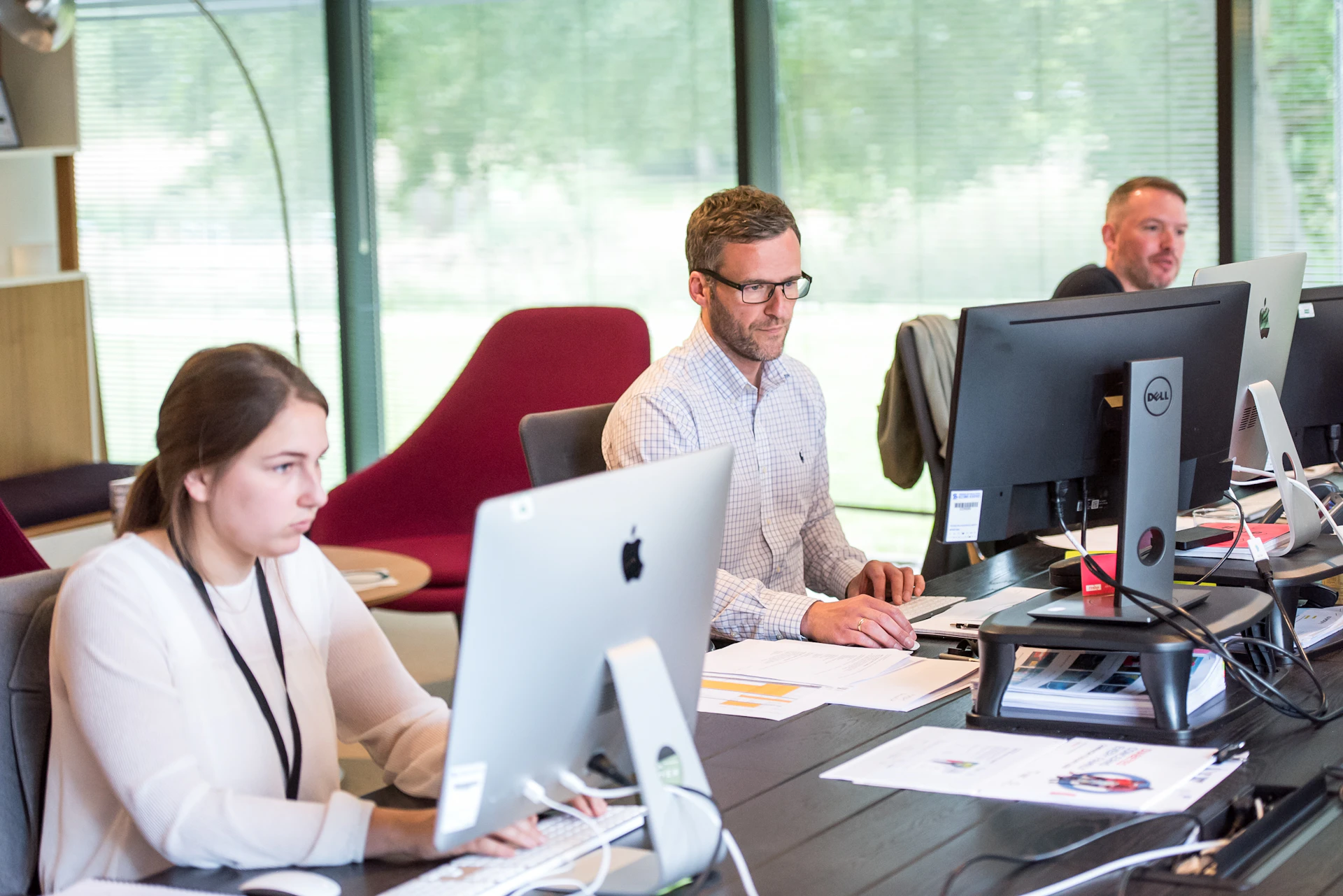 Operations professional working at an office workstation