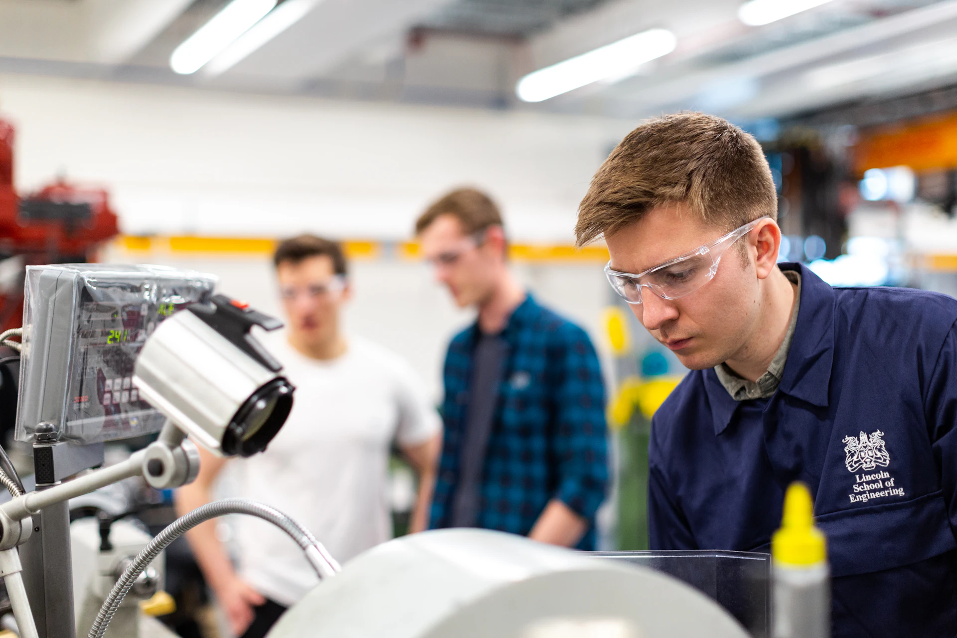 Mechanical engineer assembling a robot in a workshop