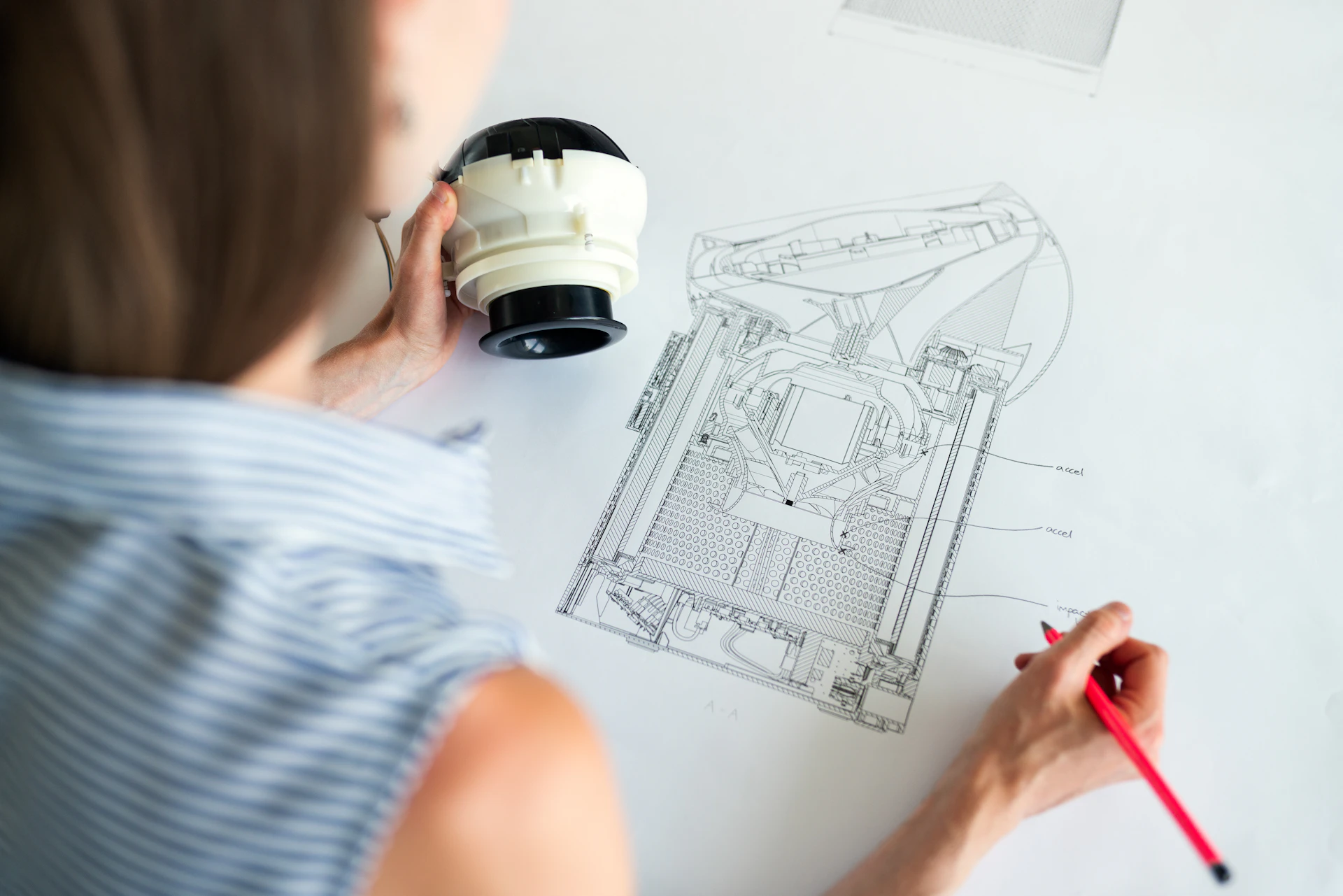 Noise and vibration engineer reviewing a product drawing