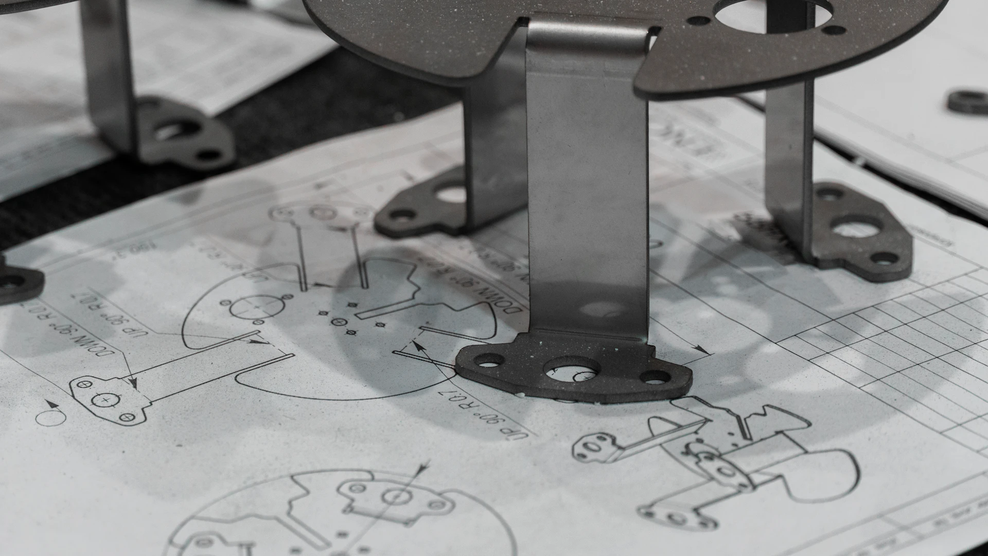 Manufactured component being checked against engineering drawings